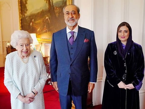 Britain's Queen Elizabeth II with Sultan Haitham bin Tariq and his wife, Sayyida Ahad bint Abdullah, during an audience at Windsor Castle in Windsor, west of London on December 15, 2021.