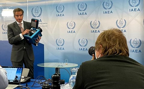 International Atomic Energy Agency Director General Rafael Grossi presents a surveillance camera at the agency's headquarters during a news conference in Vienna, Austria, December 17, 2021.