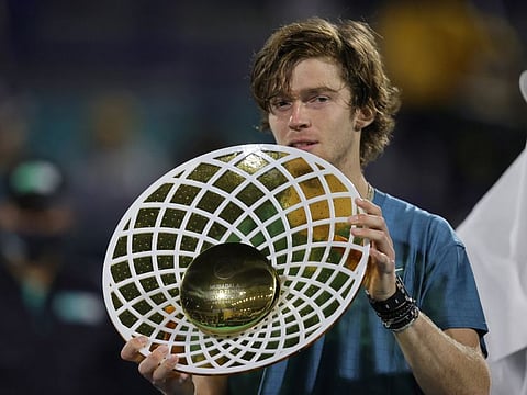 Russia’s Andrey Rublev celebrates with the trophy after winning Mubadala Tennis Championship final match against Andy Murray in Abu Dhabi.