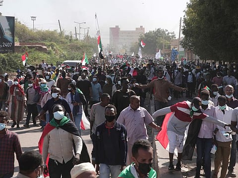 People take part in a protest against the October military takeover and a subsequent deal that reinstated Prime Minister Abdalla Hamdok in Khartoum on December 19, 2021.