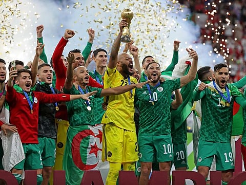 Algeria players celebrate after winning the Fifa Arab Cup 2021. Algeria defeated Tunisia in the final at the Al Bayt Stadium in city of Al Khor on Saturday.