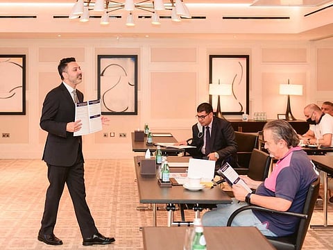 Shai Zamanian, Legal Director of The American Legal Center, at a session with clients