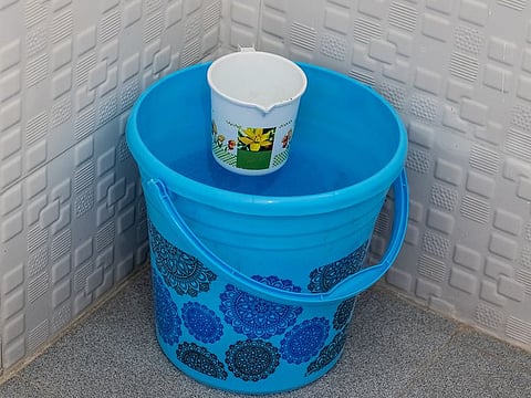 One bucket uses only 18 liters (5 gallons) of water on average. 8 minutes of showering uses up to 80 liters (~21 gallons) of water.
