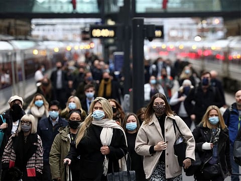 People walk along a platform at Kings Cross train station during morning rush hour, amid the coronavirus disease (COVID-19) outbreak in London, Britain.