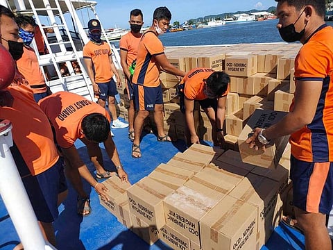 Philippine Coast Guard personnel unload packs of relief goods for victims of Typhoon Rai, in Bacolod City, Negros Occidental, Philippines, December 21, 2021