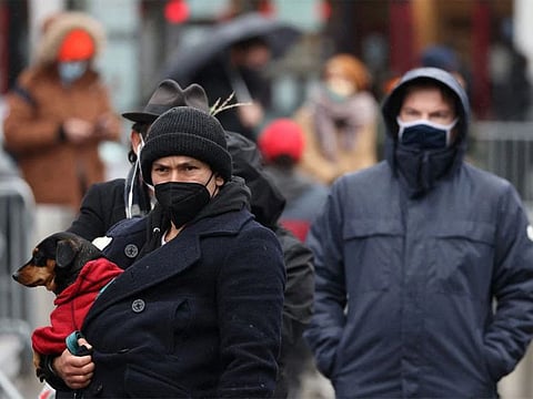 People line up outside the Barclays Center for COVID-19 testing as the Omicron variant continues to spread in Brooklyn, New York City.