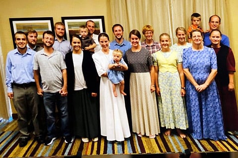 A photo of the 17 freed hostages taken in Florida is seen at the press conference at Christian Aid Ministries home office in Berlin, OH on December 20, 2021.