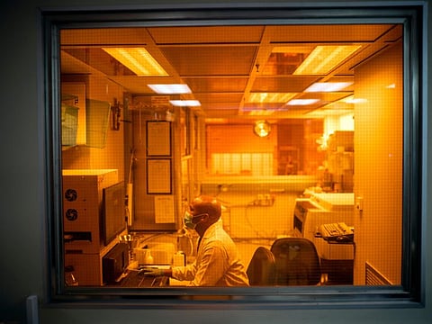 Sandile Cele, a researcher at the Africa Health Research Institute in Durban, South Africa, works on the Omicron variant of the COVID-19 virus.