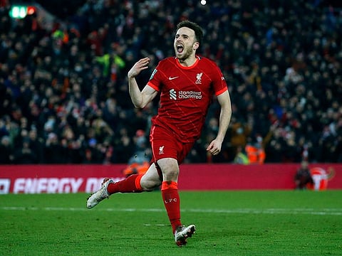 Liverpool's Diogo Jota celebrates scoring the winning penalty in the shoot-out against Leicester City.