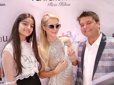 Vijay Samyani of Concept Brands Group with Paris Hilton and his daughter Avani. Celebrity endorsed brands are turning out to be quite the lucrative line for retailers.
