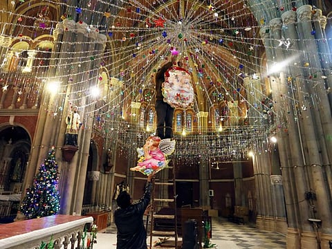 Pakistani Christians decorate the main hall of Sacred Heart cathedral church for Christmas, in Lahore.