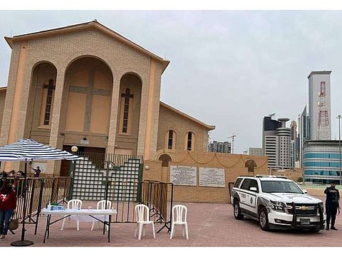 Security personnel on duty outside a church in Kuwait.