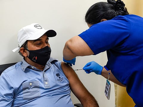 A resident getting Pfizer Covid-19 vaccine at Zabeel Primary Health Centre on Sunday.