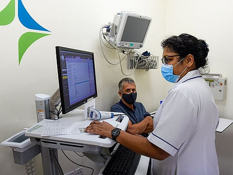 A medical staff administers the Pfizer Covid-19 vaccine at Zabeel Primary Health Centre in Dubai.
