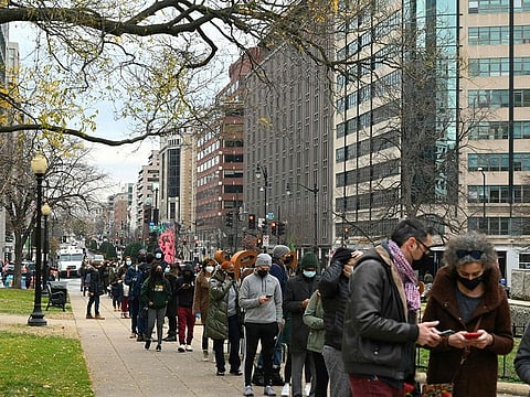 Among people fully vaccinated between December 2020 and October 2021, only those with at least one risk factor had severe outcomes or death. File photo shows people lining up to get tested for COVID-19 at a testing site in Washington, DC