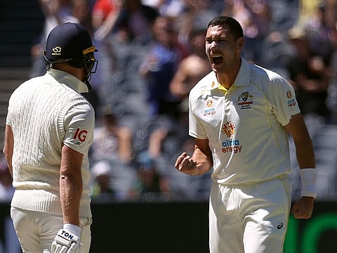 Australia's Scott Boland celebrates after dismissing England's Jonny Bairstow during the third Ashes Test at Melbourne Cricket Ground on December 28.