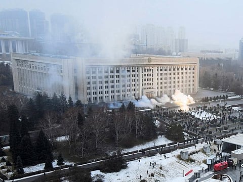 Smoke rises from the city hall building during a protest in Almaty, Kazakhstan, Wednesday, January 5, 2022.