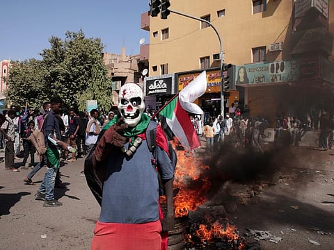 People chant slogans during a protest to denounce the October 2021 military coup, in Khartoum, Sudan, on January 4, 2022.