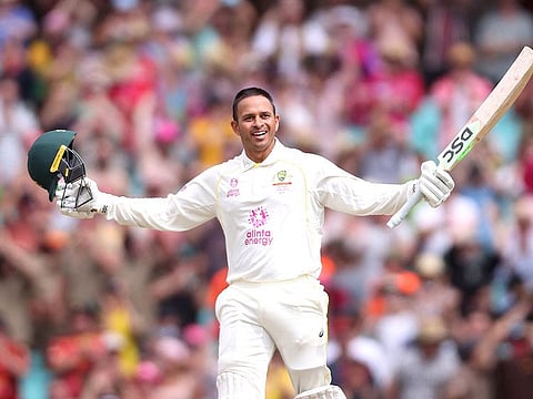 Usman Khawaja acknowledges cheers of the crowd after returning to Sydney for another big hundred four years later.