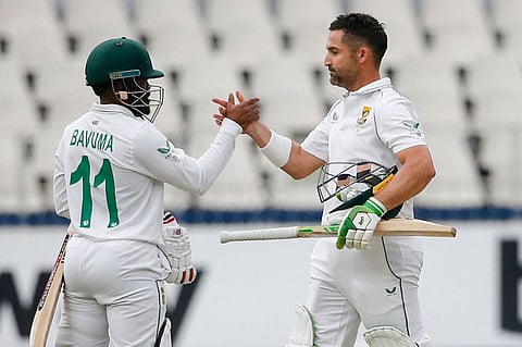 South African skipper Dean Elgar (right) celebrates the victory over India with teammate Temba Bavuma (L) at the Wanderers in Johannesburg on Thursday.