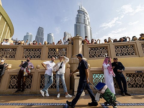 Tourists near the fountain area of the Dubai Mall.