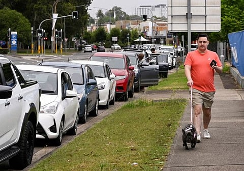 Motorists queue up in a two-km-long line at a COVID testing centre in Western Sydney on January 5, 2022.
