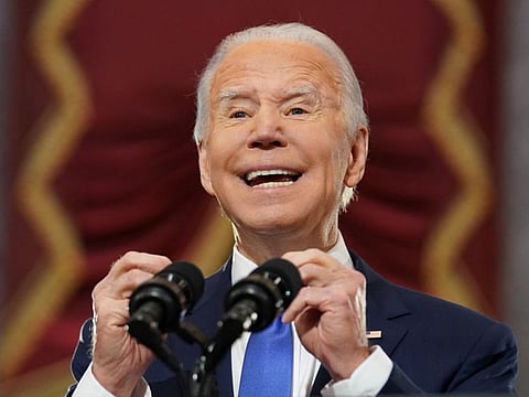 US President Joe Biden speaks in Statuary Hall on the first anniversary of the January 6, 2021 attack on the US Capitol by supporters of former President Donald Trump, on Capitol Hill in Washington, on January 6, 2022.
