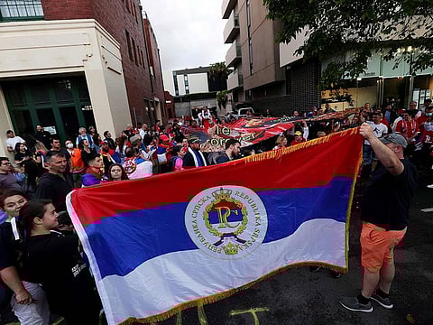 Supporters of Serbia's Novak Djokovic gather outside a government detention centre where the tennis champion is reported to be staying in Melbourne on Friday.