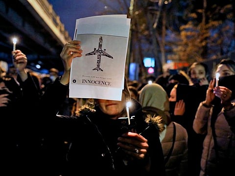 People gather for a candlelight vigil to remember the victims of the Ukraine plane crash, at the gate of Amri Kabir University in Tehran, in a file picture.
