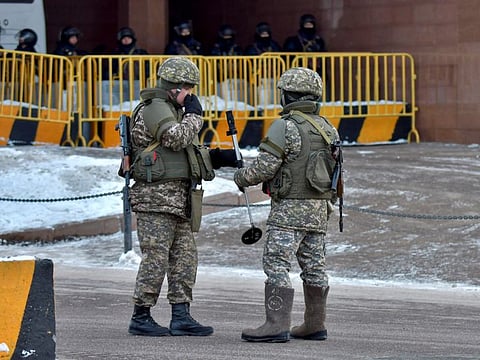 Kazakh law enforcement officers block a street leading to the official presidential residence Akorda after protests against the government, following authorities' decision to lift price caps on liquefied petroleum gas, in Nur-Sultan, Kazakhstan, January 6, 2022.