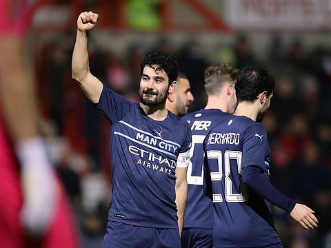 Manchester City's Ilkay Gundogan celebrates scoring their third goal.
