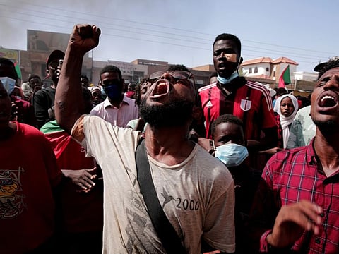 People chant slogans during a protest in Khartoum on January 6, 2022.