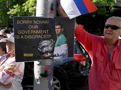 Protestors rally outside a government detention centre where Serbia's tennis champion Novak Djokovic is being held
