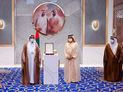 Sheikh Mohammed bin Rashid Al Maktoum (centre) honours Khalaf Al Habtoor (left) in the presence of Lieutenant General Dhahi Khalfan Tamim (right) during the award ceremony at Expo 2020 Dubai on Tuesday