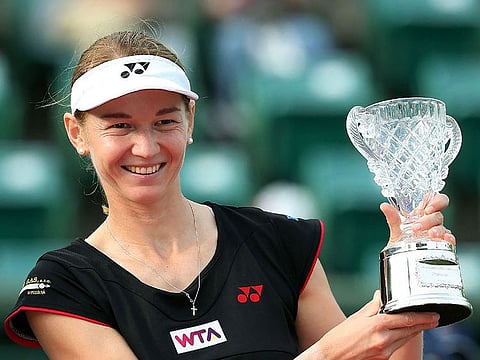 In this file photo taken on October 12, 2014 the Czech Republic's Renata Voracova poses with her trophy after winning the women's doubles final at the Japan Women's Open tennis tournament in Osaka, western Japan.