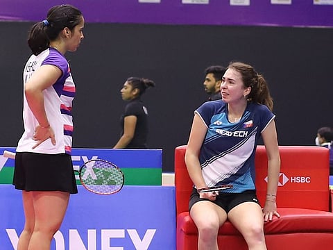 Saina Nehwal (left) checks on rival Czech Republic’s Tereza Svabikova, who suffered a back injury at the start of the second set and conceded the match.