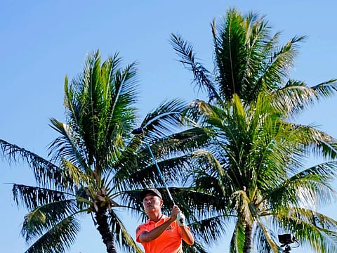 Early leader Kevin Na plays his shot from the 14th tee during the first round of the Sony Open golf tournament on Thursday.