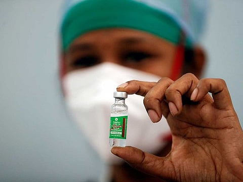 A nurse displays a vial of COVISHIELD, the AstraZeneca COVID-19 vaccine manufactured by Serum Institute of India, at a medical centre in Mumbai, India, January 16, 2021.