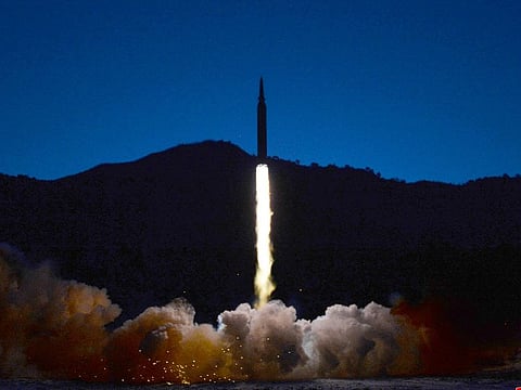 FILE PHOTO: A missile is launched during what state media report is a hypersonic missile test at an undisclosed location in North Korea, January 11, 2022, in this photo released January 12, 2022 by North Korea's Korean Central News Agency (KCNA).