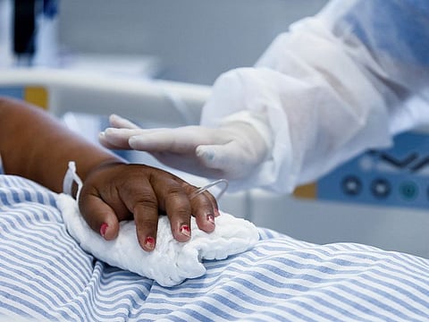 A medical worker takes care of a COVID-19 patient at the intensive care unit (ICU) of Hospital das Clinicas, in Porto Alegre, Brazil.