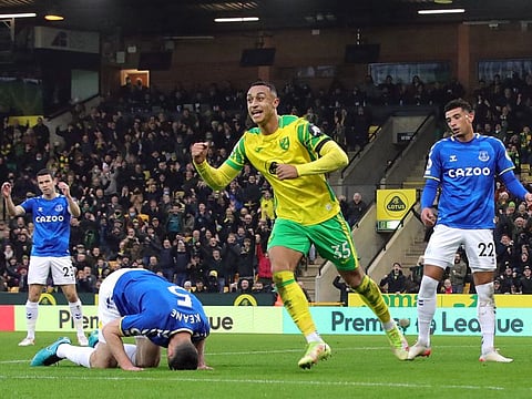 Norwich City's Adam Idah celebrates as Everton's Michael Keane looks dejected after scoring an own goal.