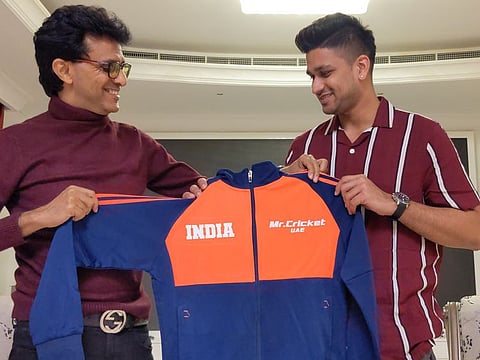 Birthday boy: Manjot Kalra (right) receives a 'Mr Cricket UAE' jacket from Anis Sajan on the former's birthday.