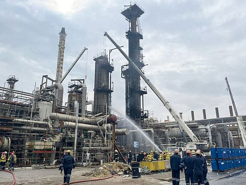 Firefighters extinguishing a fire at Al Ahmadi refinery south of Kuwait City on January 14, 2022.