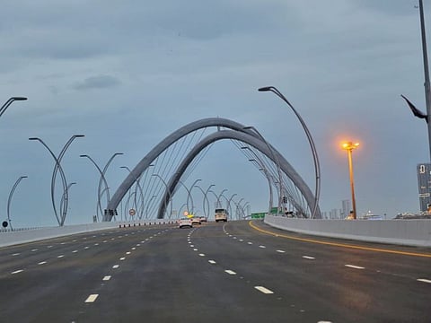 Early morning commuters on the newly opened Infinity Bridge. It took one-two minutes to drive past the new bridge.