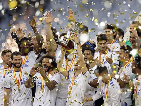 Real Madrid players celebrate winning the Spanish Super Cup final football match against Athletic Bilbao at the King Fahd International stadium in the Saudi capital of Riyadh. Real Madrid won the Spanish Super Cup by beating Athletic Bilbao 2-0 as Luka Modric and a Karim Benzema penalty secured a comfortable victory in Saudi Arabia.