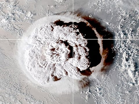 The eruption of an underwater volcano off Tonga, which triggered a tsunami warning for several South Pacific island nations, is seen in an image from the NOAA GOES-West satellite taken at 05:00 GMT January 15, 2022.