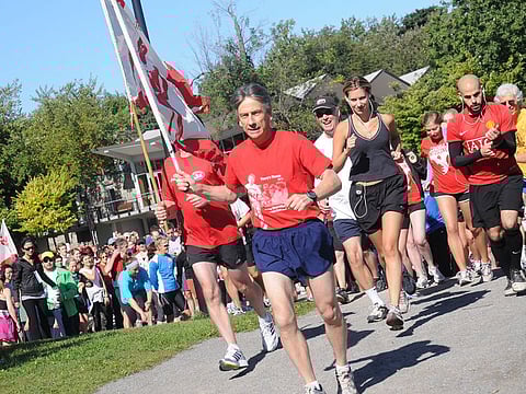 Organised by Canadian Business Council Dubai and hosted by Expo 2020 Dubai, this year’s Terry Fox Run in Dubai continues its tradition as a 3 or 5km non-competitive family fun run. Photo of 2011 Montreal Run with marathoner Eddy Nolan holding the flag.