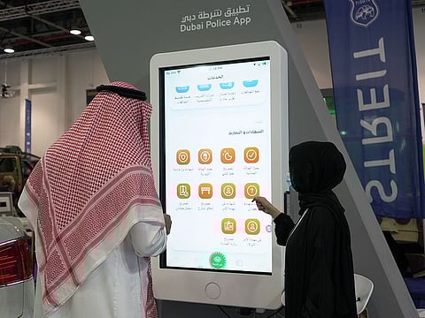 A visitor learns about Dubai Police smart services at Intersec at Dubai World Trade Centre