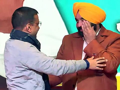 Delhi Chief Minister Arvind Kejriwal congratulates Aam Aadmi Party (AAP) MP Bhagwant Mann for being elected as the party's Chief Ministerial candidate ahead of the upcoming Punjab Assembly elections, in Mohali on Tuesday.