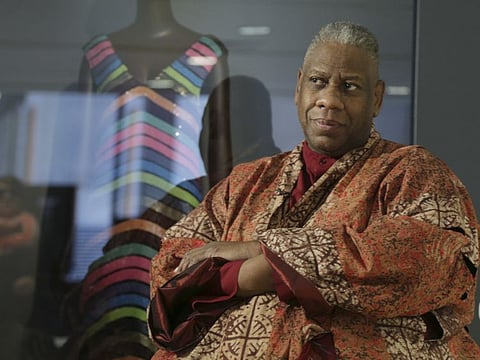 André Leon Talley, a former editor at large for Vogue magazine, speaks to a reporter at the opening of the "Black Fashion Designers" exhibit at the Fashion Institute of Technology in New York, Tuesday, Dec. 6, 2016. Talley, the towering former creative director and editor at large of Vogue magazine, has died. He was 73.